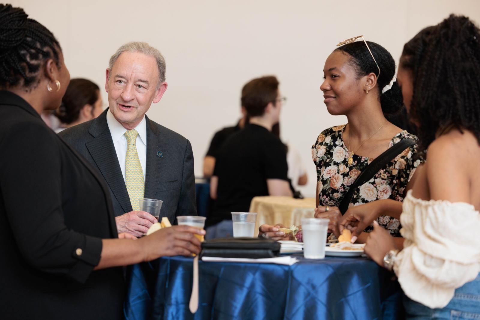 Students enjoying the GPSAW Reception with GW President Mark Wrighton